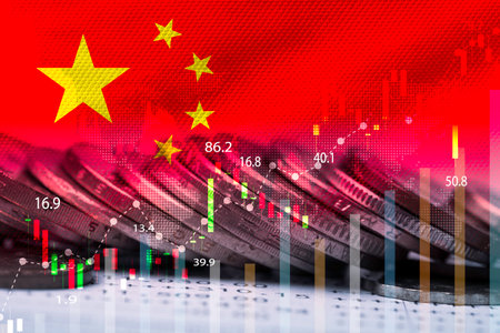 Double exposure of China flag on coins stacking and stock market graph chart .It is symbol of china high growth economy and investment  technology concept.の写真素材