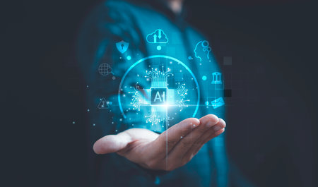 Businessman holding virtual AI or Artificial Intelligence with technology icons include cloud computing chatbot internet banking etc for AI learning management and working behalf of human concept.の写真素材