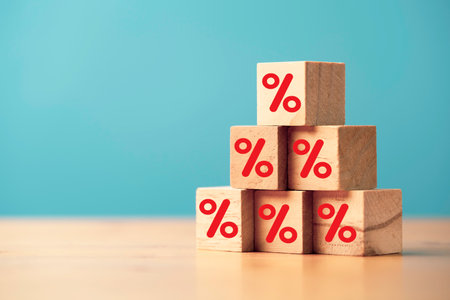 Red percentage sign symbol print screen on wooden cube block stacking for increasing interest and dividend form investment concept.の写真素材