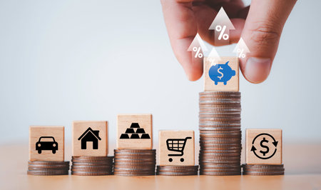 Hand putting piggy saving bank icon on the highest coins stacking with up arrow  , Money saving and deposit for investment to get profit and dividend concept.の写真素材