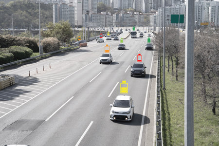 Electric car driving with battery icon on road for clean energy vehicle or EV in future concept.の写真素材