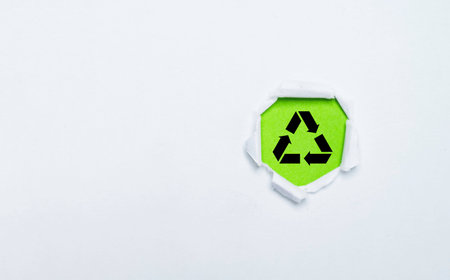Black recycle icon sign on green background for  recycling packing product and rubbish  , sustainable development to save ecology environment concept.の写真素材