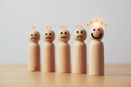 Wooden figure smile with five stars for client excellent evaluate after use product and service concept.の写真素材