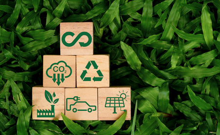 Infinity symbol with Circular business economy environment icons on wooden block cube and grass for future sustainable investment growth and reduce environmental pollution for future concept.の写真素材