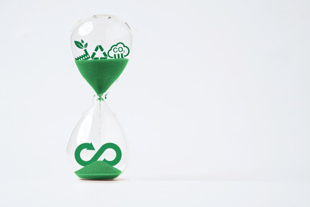 Infinity symbol with Circular business economy environment icons inside hourglass  for future sustainable investment growth and reduce environmental pollution concept.の写真素材