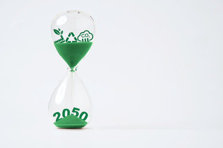 Carbon reduction and environment icon inside of sand clock for Kyoto Protocol 2050 for carbon footprint and carbon credit emission to limit global warming from climate change concept.の写真素材