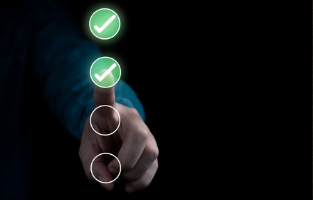 Businessman touching to tick correct sign mark in checkbox for quality document control checklist...