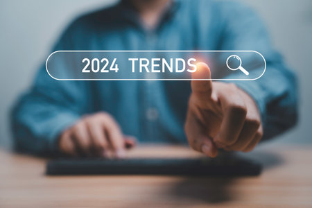 Businessman touching to search engine bar with 2024 trends wording for marketing monitor and business planing in new year concept.の写真素材