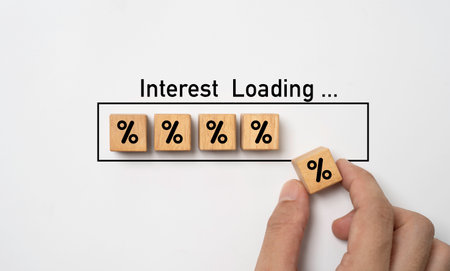 Hand assemble percentage symbol  which print screen wooden block cube and inside of download icon...