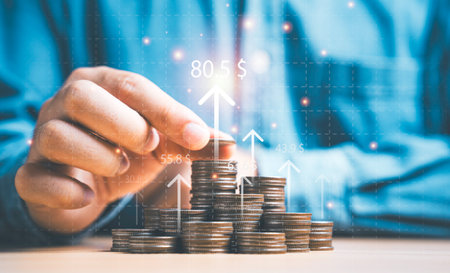 Two hand giving heap of coins money with up arrow and percentage symbol for financial banking increase interest rate or mortgage investment dividend from business growth concept.の写真素材