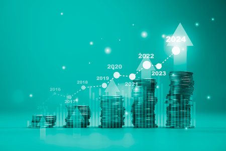 Coins stacking and increasing graph and up arrow on green background for economic growth, dividend from investment and bank saving concept.の写真素材