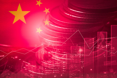 Double exposure of China flag on coins stacking and stock market graph chart .It is symbol of china high economy growth , inflation and recession concept.の写真素材
