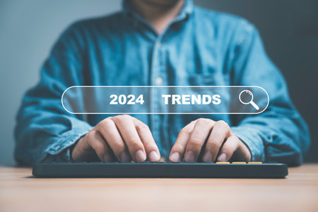 Businessman typing keyword 2024 trends on searching bar for business marketing searching and planning concept.の写真素材