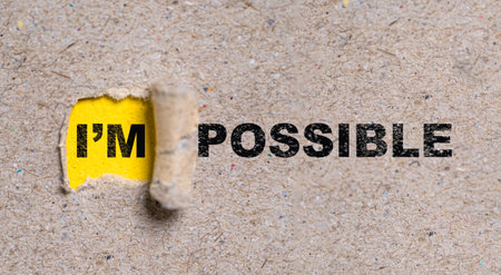Yellow torn paper with I'm possible  wording , Positive thinking mindset and human inspiration development concept.の写真素材