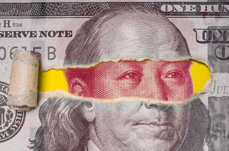 Mao Tse Tung face of Yuan banknote inside Benjamin Franklin of USD dollar banknote for China economy military conflict and technology disrupt to United States of America concept.の写真素材