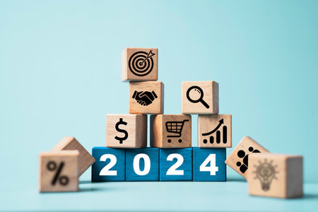2024 on wooden block cube and business icons include hand shaking, target,percentage and lightbulb...