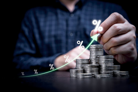 Businessman hand drawing virtual increasing graph with heap of coins stacking and percentage, Business investment profit and deposit dividend saving growth concept.の写真素材