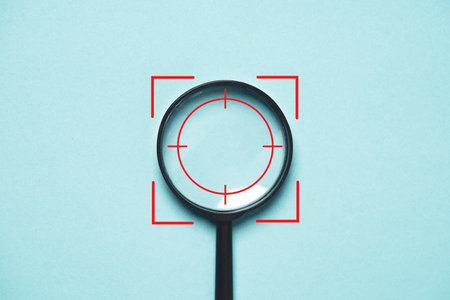 Focus icon inside of magnifier glass for concentrate with business objective goal and target on blue...