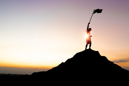 Silhouette businessman standing on top of mountain and holding a flag with over sunlight for leadership business successful and achieve objective target concept.の写真素材