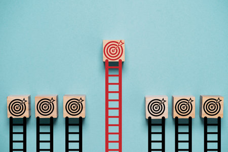 Long staircase lead to red dartboard with arrow it different from short staircase black dartboard for enhance and outstanding of business objective target goal concept.の写真素材