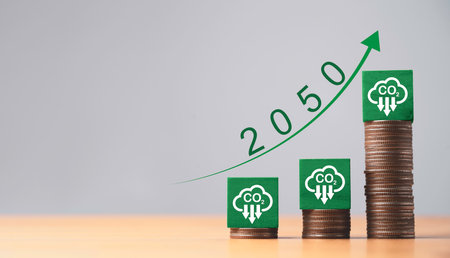 Reduction carbon emission symbol on increasing coins stacking for carbon footprint to limit global...