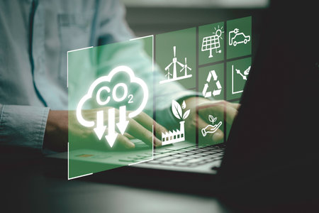 Business using laptop with CO2 reducing icon for new business manage decrease CO2 , carbon footprint and carbon credit to limit global warming from climate change, Bio Circular Green Economy concept.の写真素材