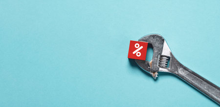 Red percentage sign symbol was compress by wrench torque for control of banking interest rating with...