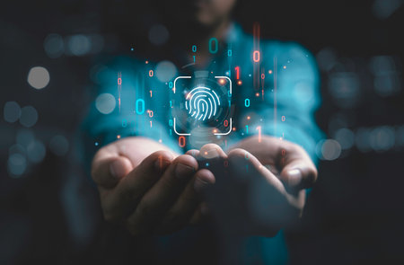 Businessman holding virtual finger print and binary code for internet access and biometric encryption for cybersecurity network and user security concept.の写真素材