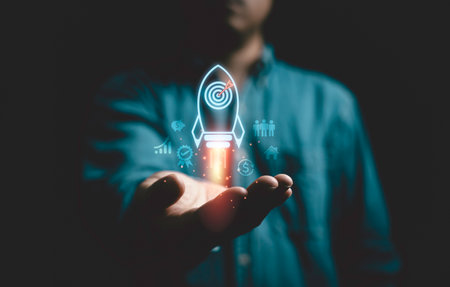 Businessman holding rising of missile rocket with dartboard with arrow for enhance and achieve business objective target and goal concept.の写真素材