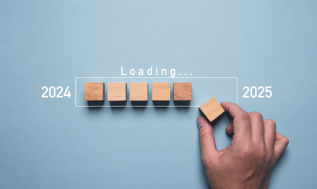 Hand assemble wooden block cube to update technology downloading tool bar status from 2024 to 2025 ,...
