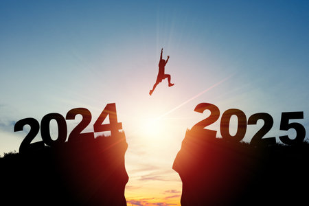 Welcome merry Christmas and happy new year in 2025,Silhouette Man jumping from 2024 cliff to 2025...