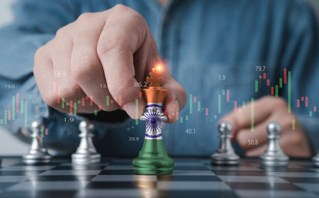 Businessman holding India flag which print screen on king chess for India country is leadership for economic growth and financial investment of South Asia concept.の写真素材