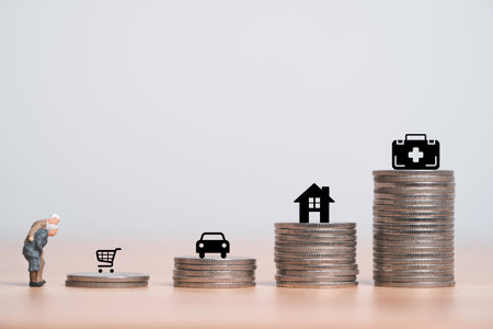 Miniature figure couple Senior Pensioners standing with increasing coins stacking and expense include consumer goods ,traveling cost, house rent and medical after retirement concept.の写真素材