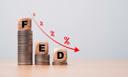 FED wording on the top of coins stacking with coins decreasing  down arrow and percentage  for FED will reduce interest rating concept.の写真素材