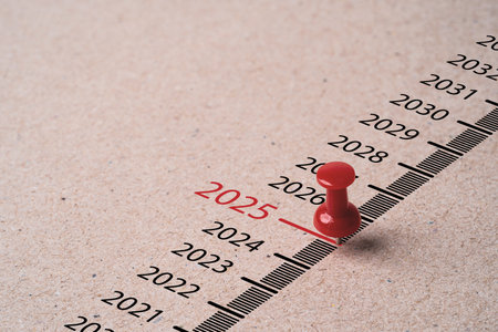 Red pin on paper with 2025 year for preparation merry Christmas and happy new year concept.の写真素材