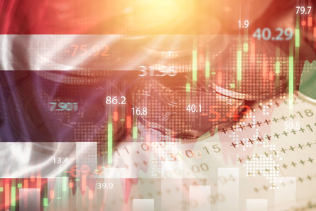 Double exposure of Thailand flag on coins stacking and stock market graph chart .It is symbol of Thailand high growth economy and investment  technology concept.の写真素材