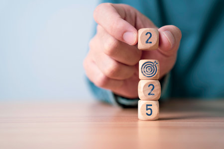 Businessman putting 2025 and target board arrow for focus and preparation business objective target and goal in new year concept.の写真素材