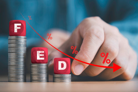 Businessman putting FED wording with down arrow and percentage sign for Federal reserve of USA decrease interest rate control which effect to America and world economic growth concept.の写真素材