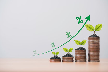 Tree growth on increasing coins stacking with up arrow and percentage for money saving to investment dividend and profit concept.の写真素材