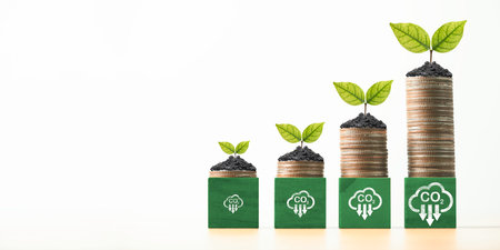 Plant growing on coins stacking with carbon reduction sign for carbon credit and footprint can make more business profit and  limit global warming from climate change concept.の写真素材