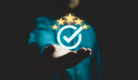 Businessman holding and showing the best quality assurance with golden five stars for guarantee product and ISO service concept.の写真素材