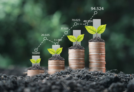 Tree growth on increasing coins stacking with up arrow and percentage for money saving to investment dividend and profit concept.の写真素材