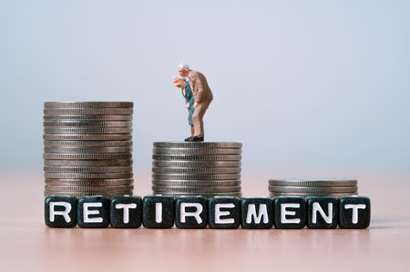 Miniature figure of Couple Senior Pensioners standing on the top coins stacking for wealth financial planning ,money saving and life insurance of retirement concept.の写真素材