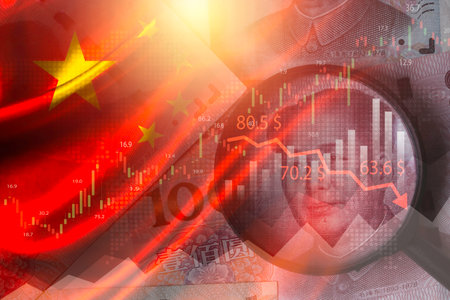 Double exposure of China flag on Yuan banknote and magnifier glass with stock market graph chart .It is symbol of china high growth economy and possibility economic crisis concepの写真素材