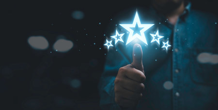 Businessman thumb up with glowing five stars for customer excellent satisfaction and product service evaluation award concept.の写真素材