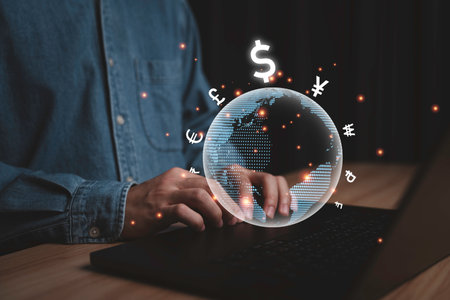 Businessman using computer laptop with virtual world and international currency include dollar Yuan Yen Euro Pound Rupee Ruble for money currency exchange and transfer concept.の写真素材