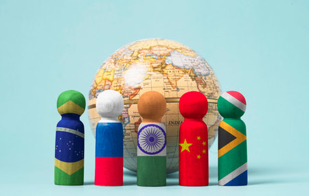 Brazil Russia India China and South Africa flags print screen on wooden miniature with world model for BRICS business and economic cooperation concept.の写真素材