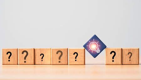 Glowing light bulb among question mark for focus and concentrate of creative thinking idea and...
