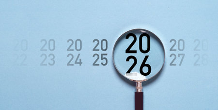 2026 year inside of magnifier glass for focus start new business in new year concept.の写真素材