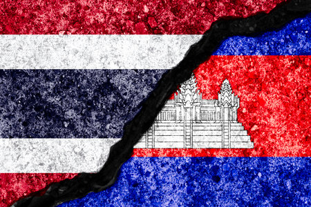 Wall crack separate between Thailand flag and Cambodia flag for government conflict from border of both countries concept.の写真素材